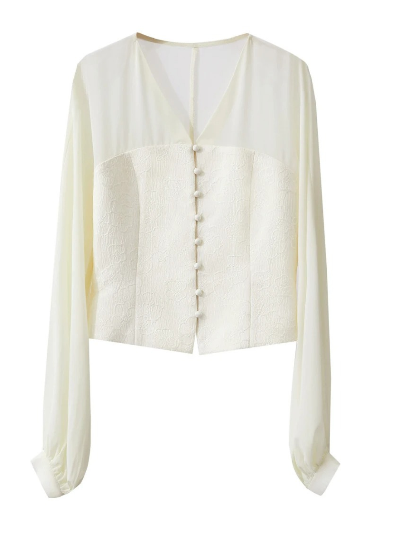 Flat lay of cream blouse showing sleeves and front buttons