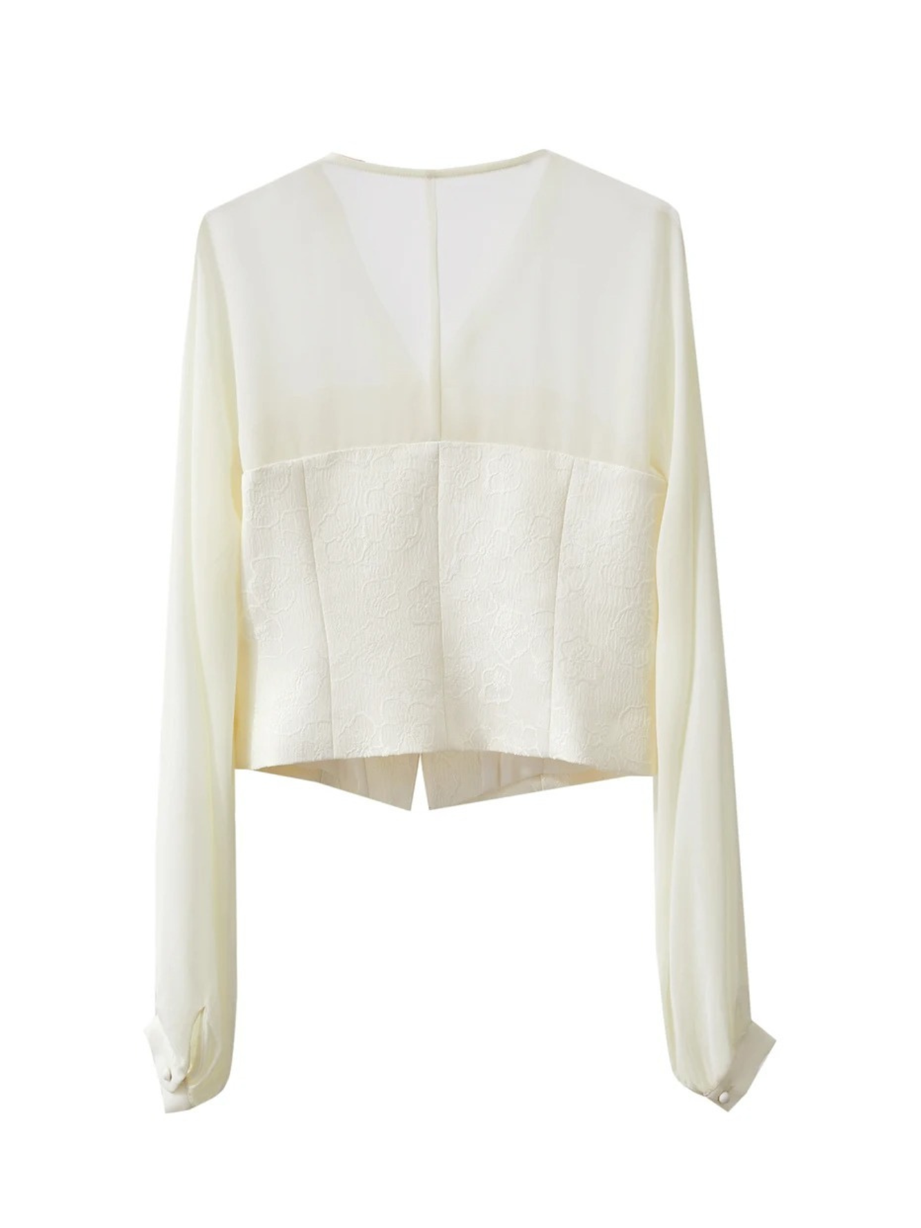 Back view of cream blouse laid flat