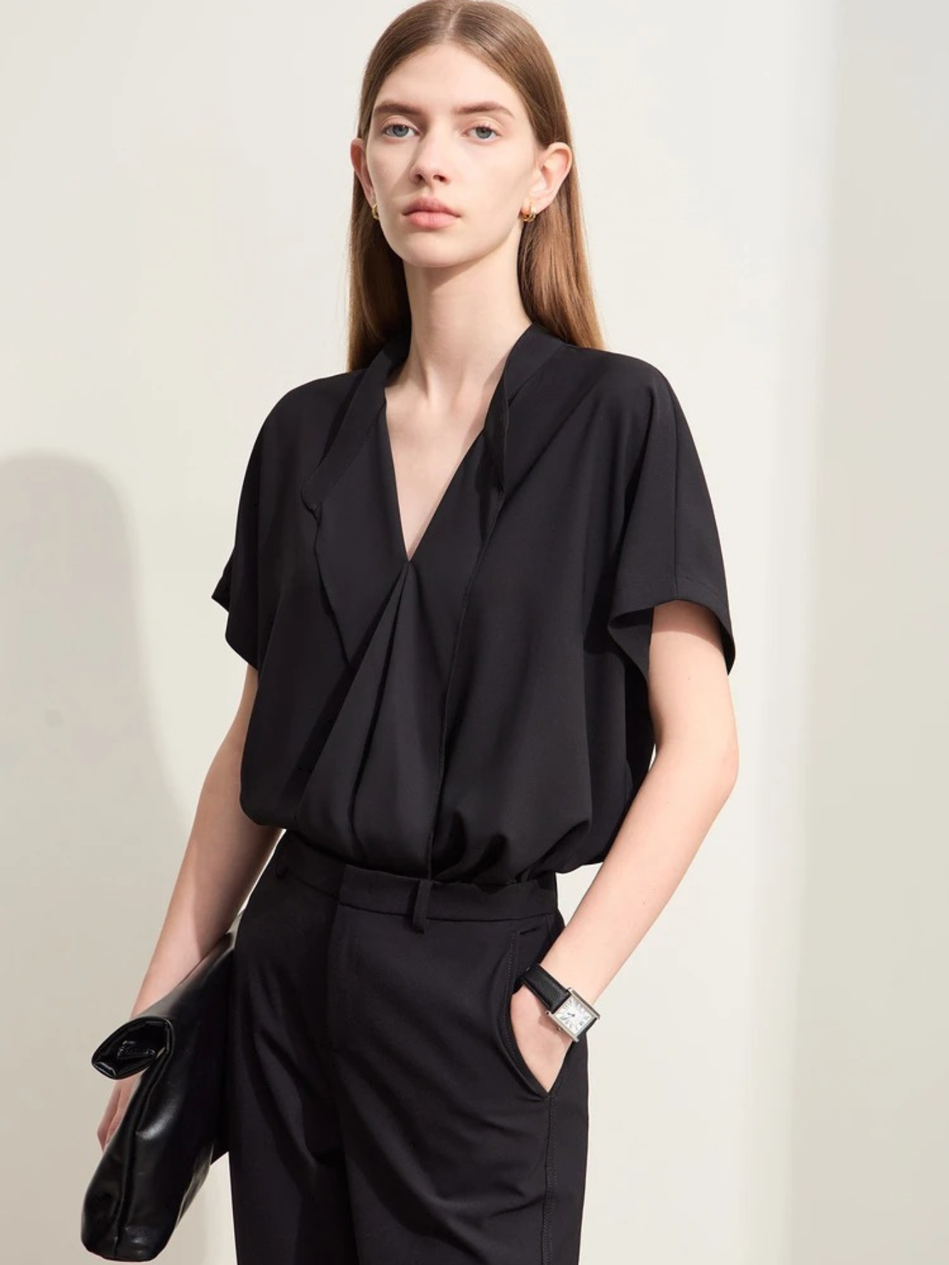 Black blouse with pleated front and side pockets