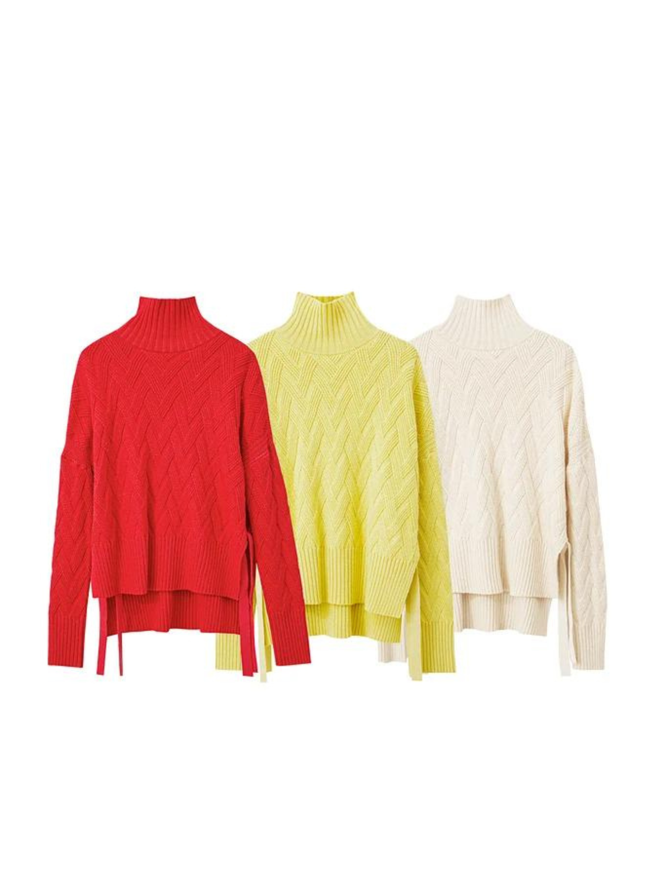 Three knit sweaters with turtleneck necklines, shorter in the front and longer in the back in red, mustard and cream colors.