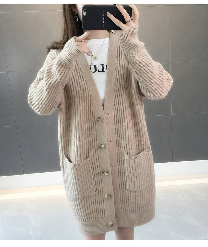 Dame cardigan med lappelommer og knappestolpe Skjora