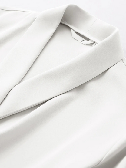 Close-up of collar and shoulder detail on white blouse