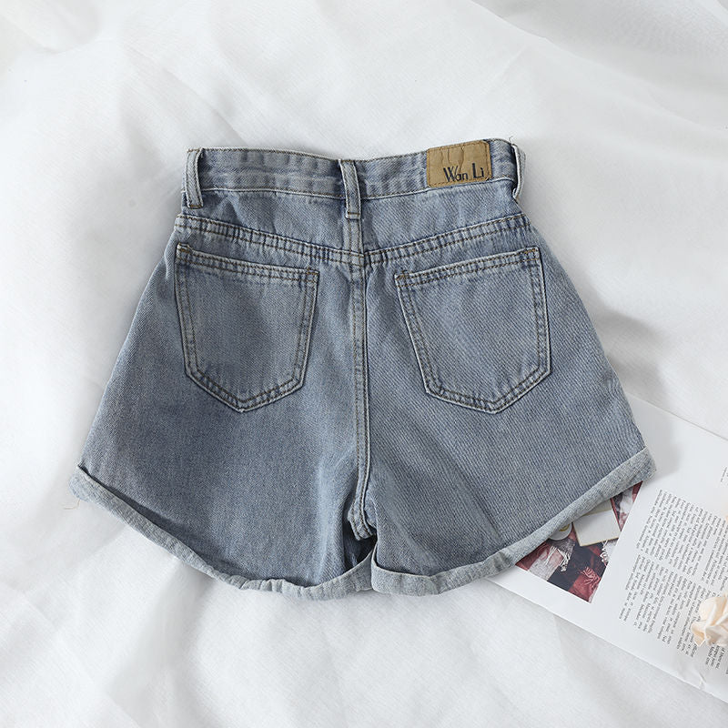 Damens høytlivs denimshorts med omslagskant og elastisk liv Skjora