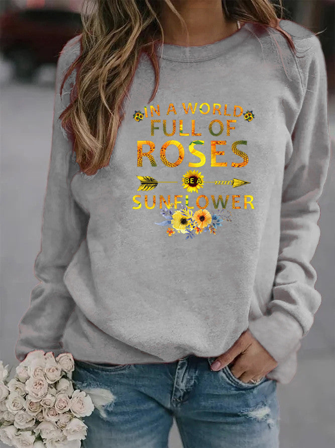 Dame sweatshirt med inspirerende design og blomsterdekorasjon Skjora