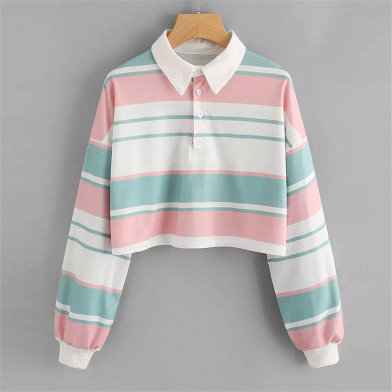 Dame polo skjorte i en avslappet crop design med et stilfullt fargeblokk mønster Skjora
