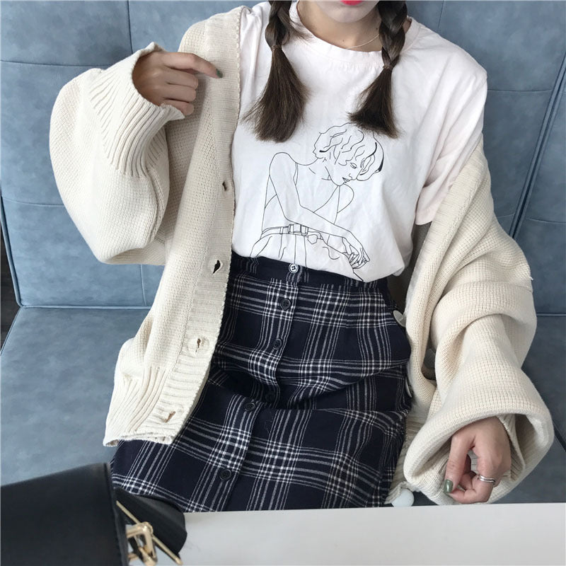 Kvinnenes store strikkede cardigan med avslappet design og knapp-lukking Skjora