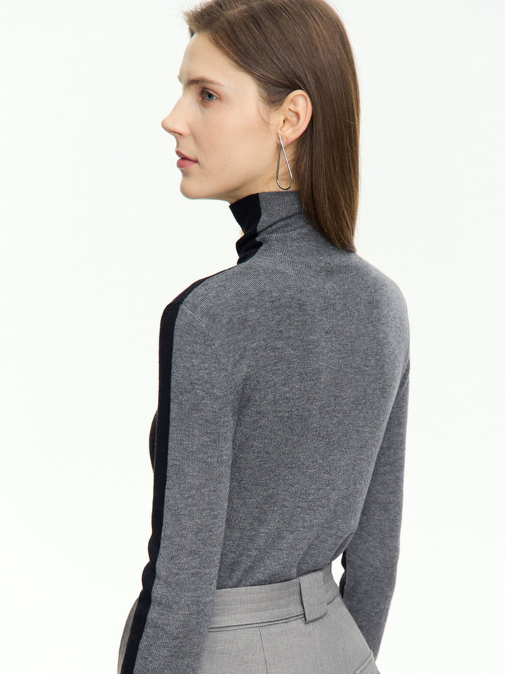 Stilig tofarget turtleneck-genser i grå og svart tofarget design