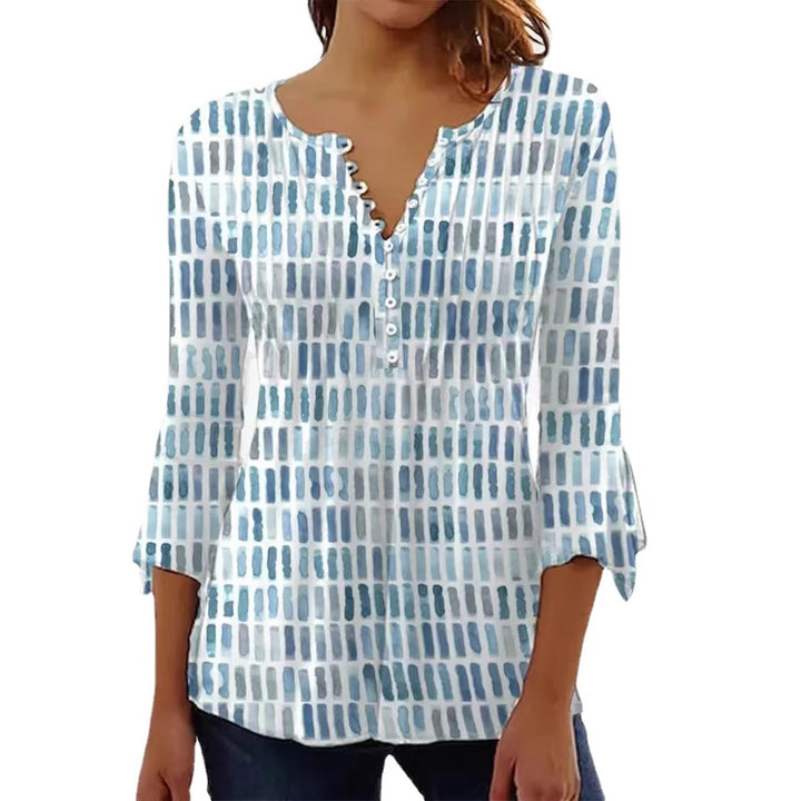 Damebluse i moderne grafisk design med knappe detaljer Skjora