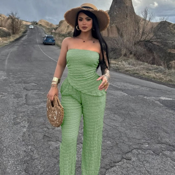 Dame elegant jumpsuit med off-shoulder design og asymmetrisk hem Skjora