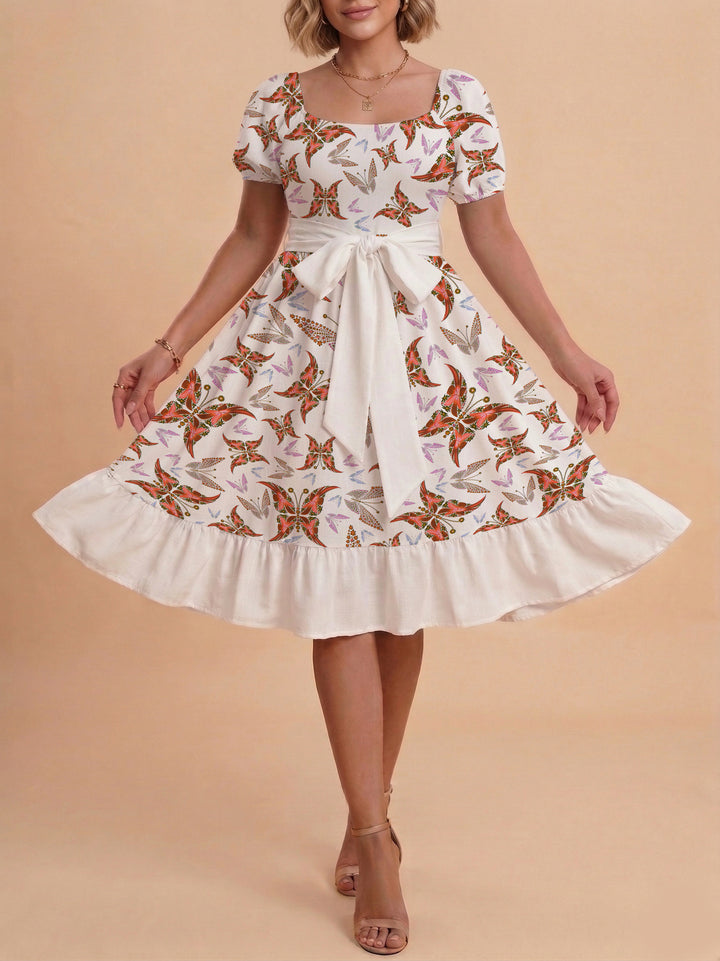 Damen modernes Blumenkleid mit elegantem Taillengürtel und asymmetrischem Saum Skjora