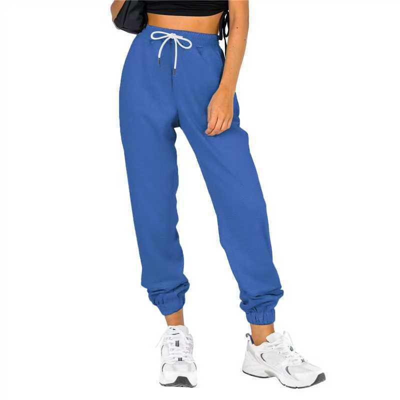 Kvinne sporty joggebukser med praktisk snor og elastisk liv.