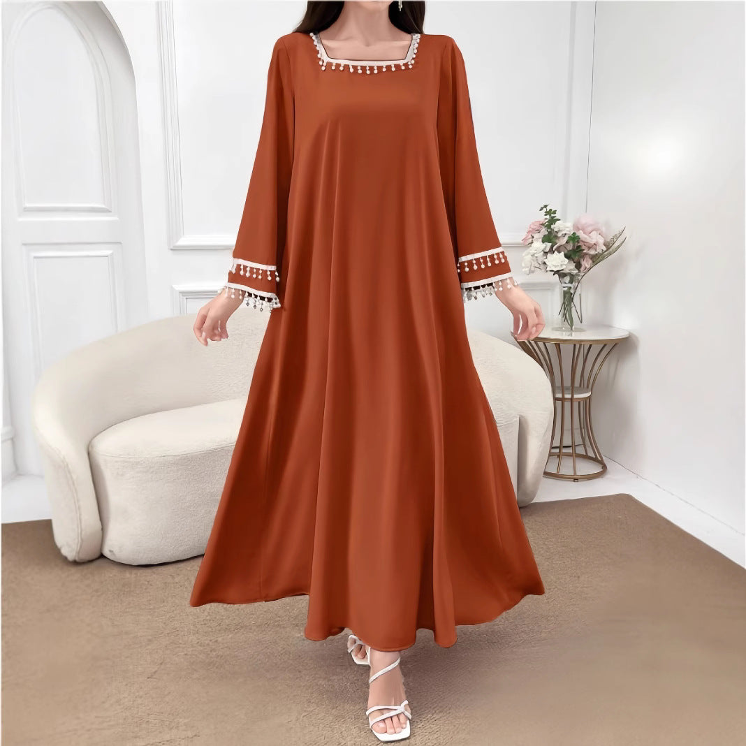 Kvinne Elegant Maxi Kjole med Dekorative Frynser og Brede Ermer Skjora