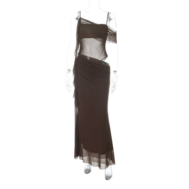 Elegant women's evening dress with refined ruffle details and transparent inserts Skjora