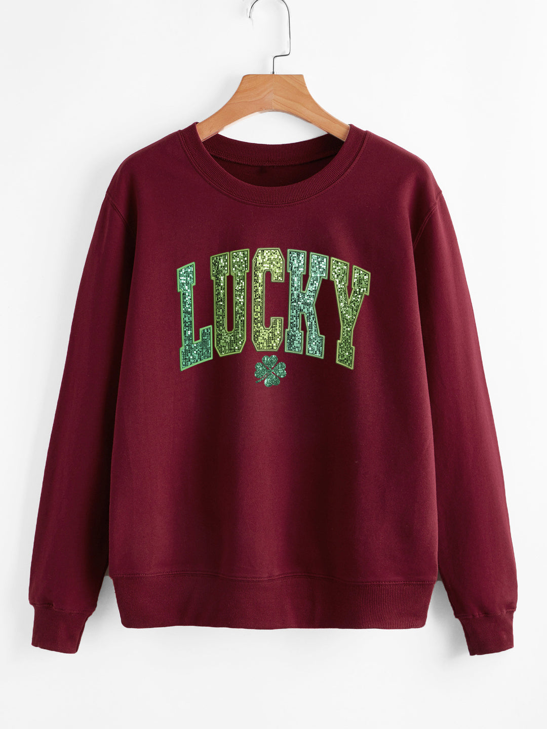 Dame uformell sweatshirt med glitrende skrift og firkløvermotiv Skjora