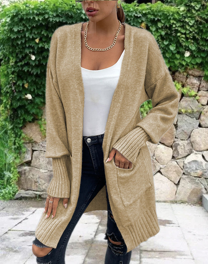 Kvinnens chunky strikk cardigan med dype lommer og avslappet design Skjora