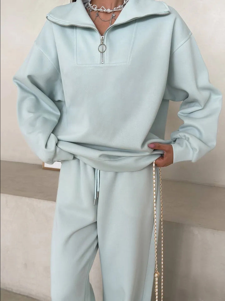 Kvinnens elegante fleece treningsoverall med høy krage og praktisk glidelås