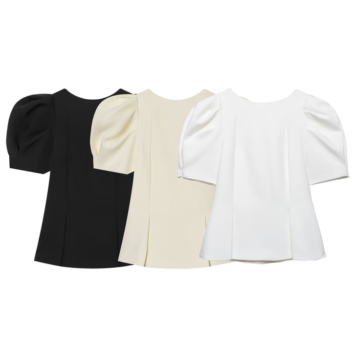 Damebluse med puffarmer og elegant snitt Skjora