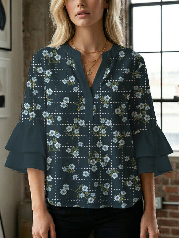 Damebluse med voluminøse ermer og blomsterdesign Skjora