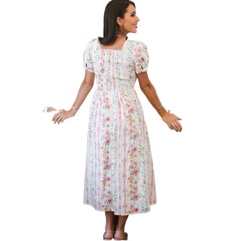 Dame Maxikjole med blomsterdesign og lange puffermar