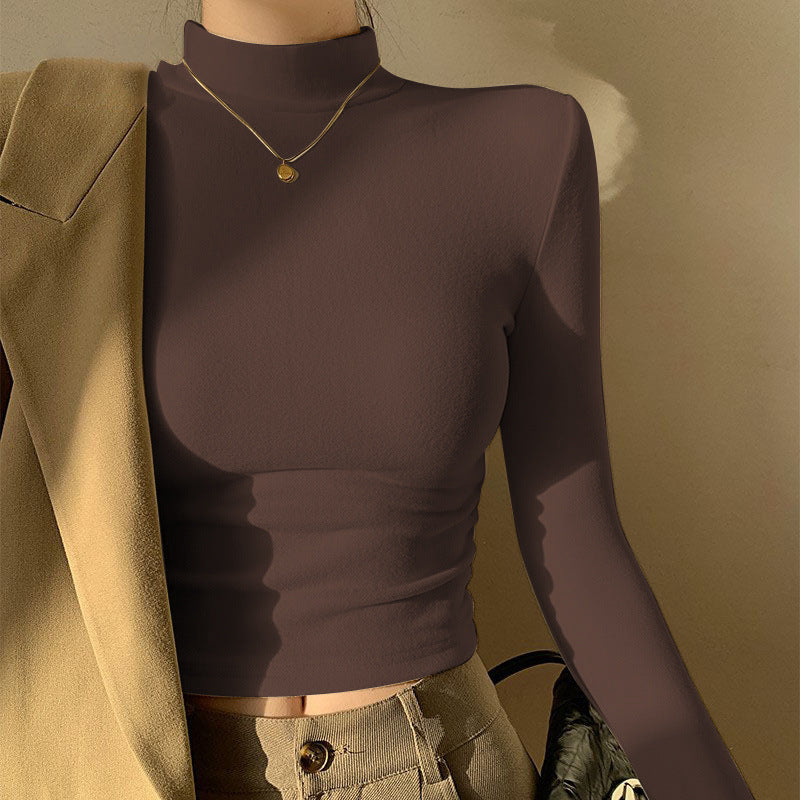 Kvinners langermet crop top med høy krage og tettsittende snitt