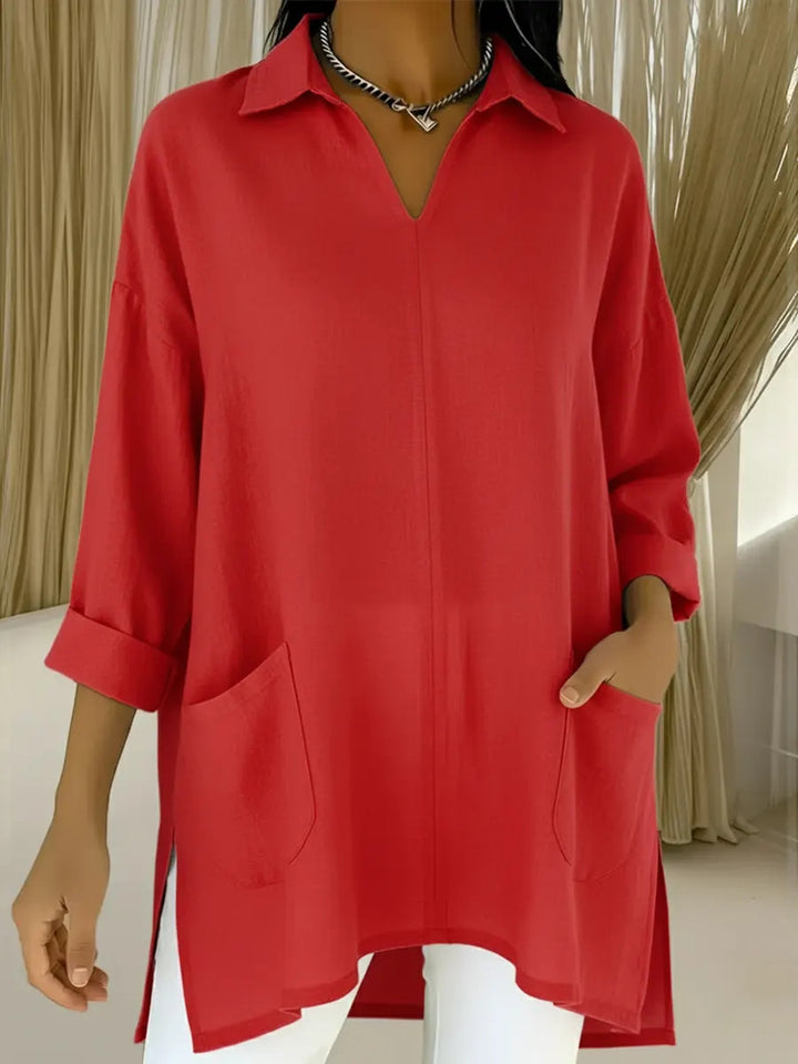 Dame langermet bluse med elegant V-hals og praktiske lommer Skjora