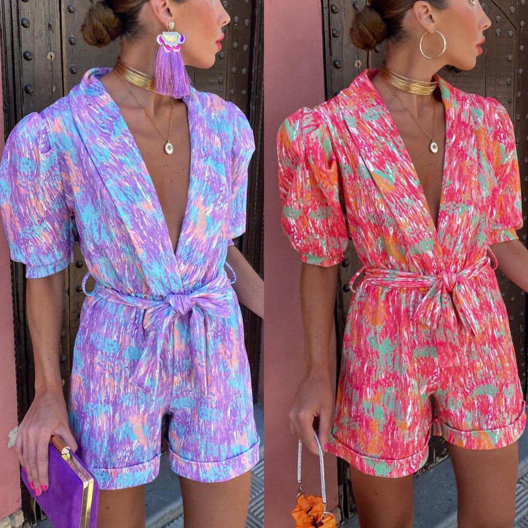 Kvinnelig Elegant Jumpsuit med Dyp V-Hals og Knappbar Belte Skjora
