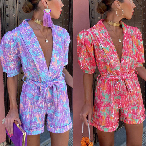 Kvinnelig Elegant Jumpsuit med Dyp V-hals og Knappbar Belte Skjora