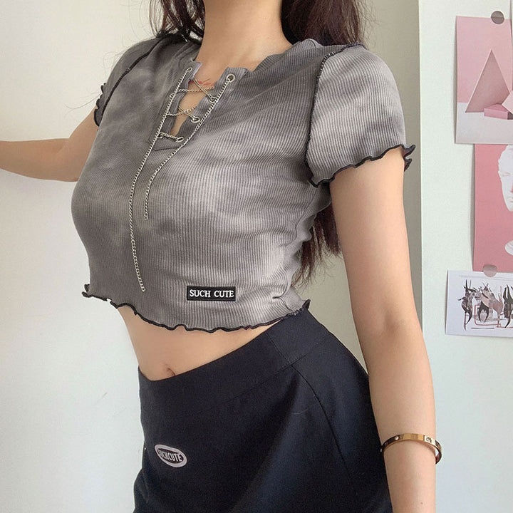 Dame cropped topp med moderne snøringdesign og avslappet kant Skjora