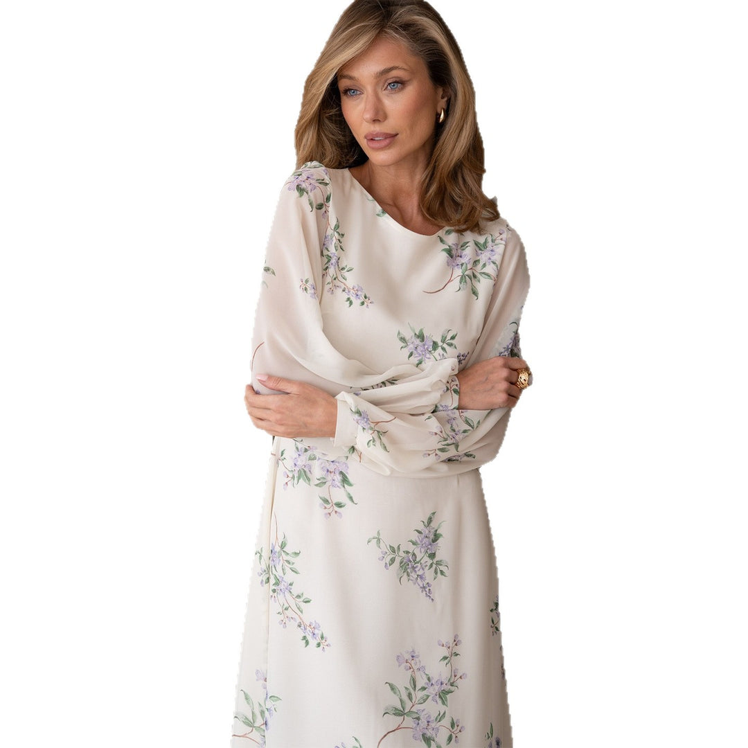 Kvinnenes maxikjole med transparente ermer og feminin blomstertrykk