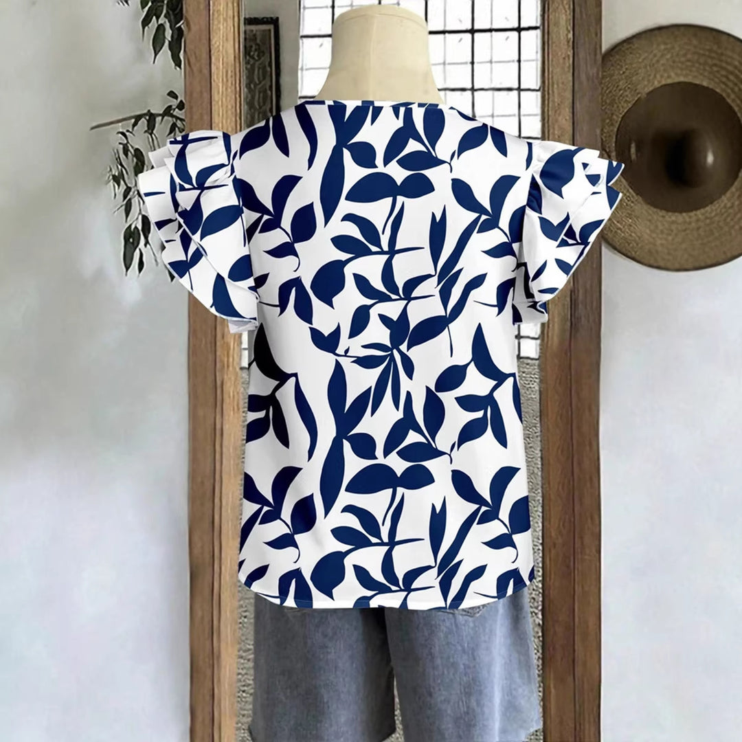 Damebluse med pufferm og blomsterdesign Skjora