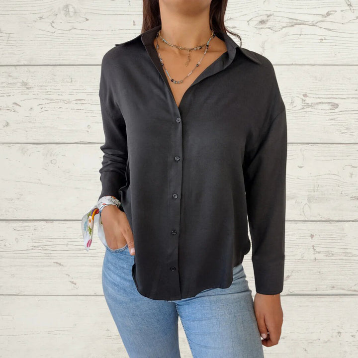Dame elegant langermet bluse med fint stoff og feminine detaljer Skjora