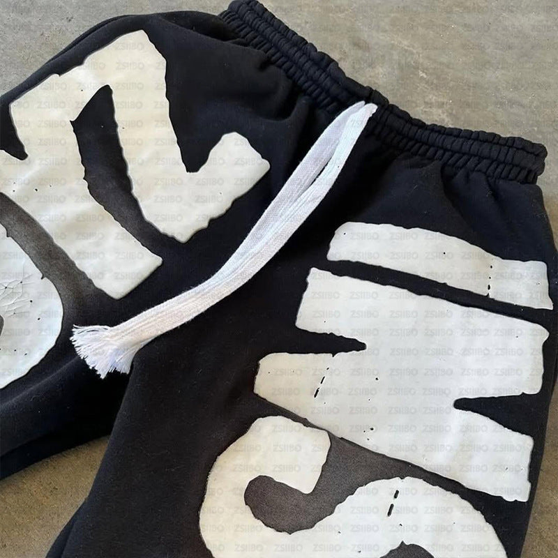 Kvinne joggebukser med stort iøynefallende logo trykk Skjora