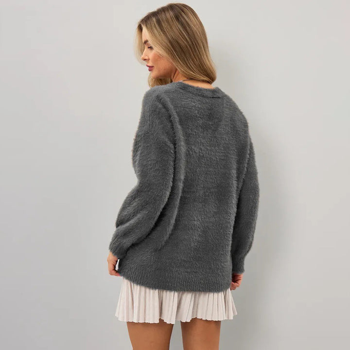 Kvinnens koselige cardigan med asymmetrisk snitt og knappeåpning Skjora