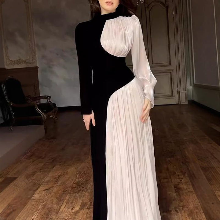 Kvinnes elegant og asymmetrisk kveldsdrakt med folderdetaljer Skjora