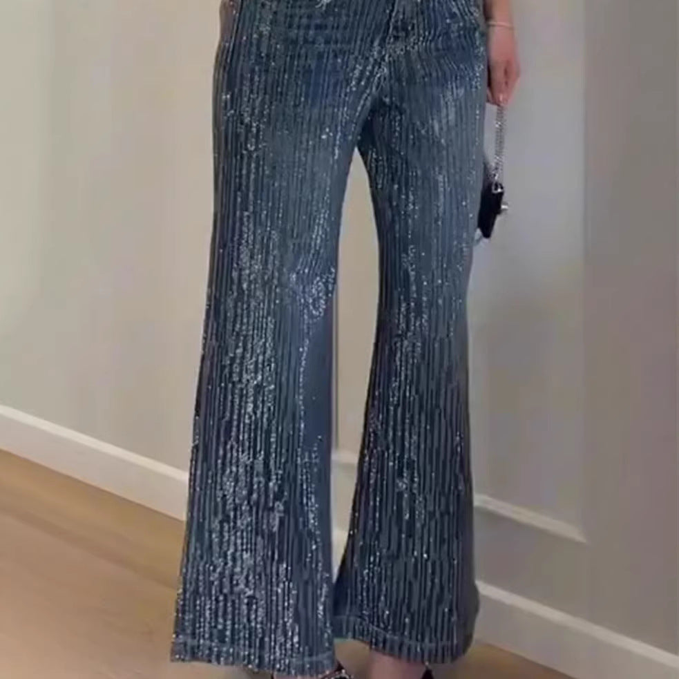 Kvinnelig glitrende vid-cut jeans med elegant tekstur Skjora