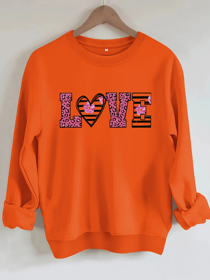 Dame sweatshirt med moderne leopard hjerte-design og behagelig passform Skjora