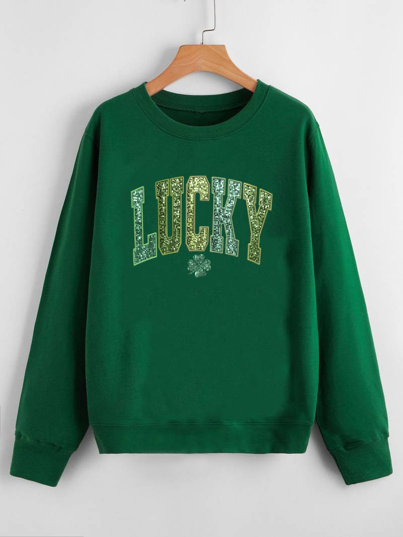 Dame uformell sweatshirt med glitrende skrift og firkløvermotiv Skjora
