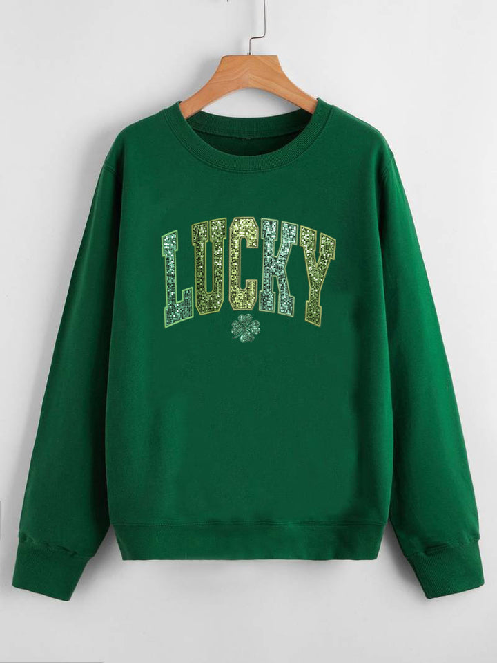 Dame uformell sweatshirt med glitrende skrift og firkløvermotiv Skjora