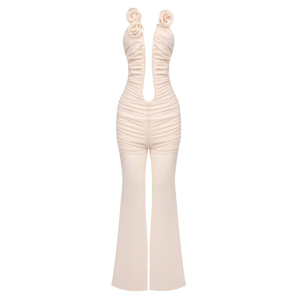 Dame jumpsuit med dyp U-utrigning og florale aksenter Skjora