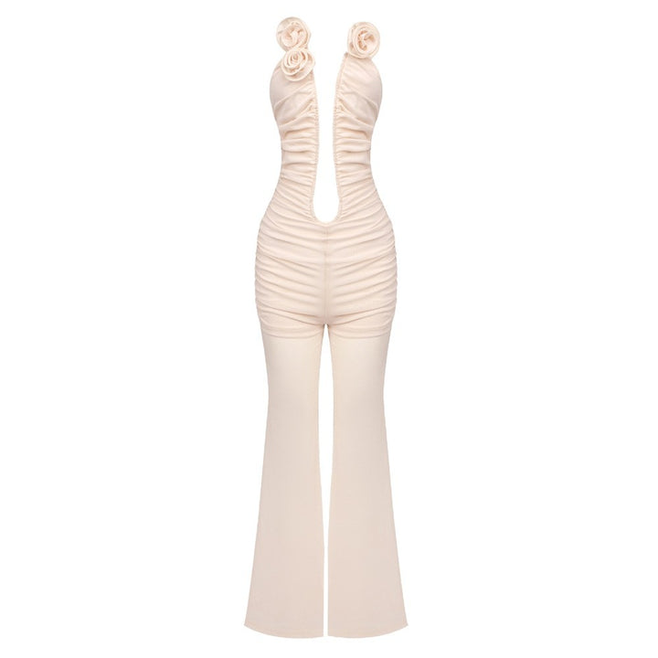 Dame jumpsuit med dyp U-utrigning og florale aksenter Skjora