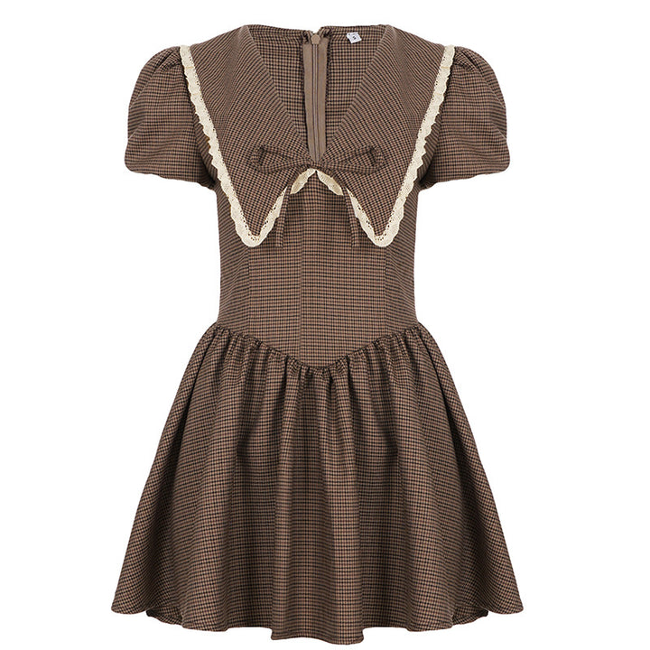 Ladies' dress with elegant collar and ruffle details Skjora