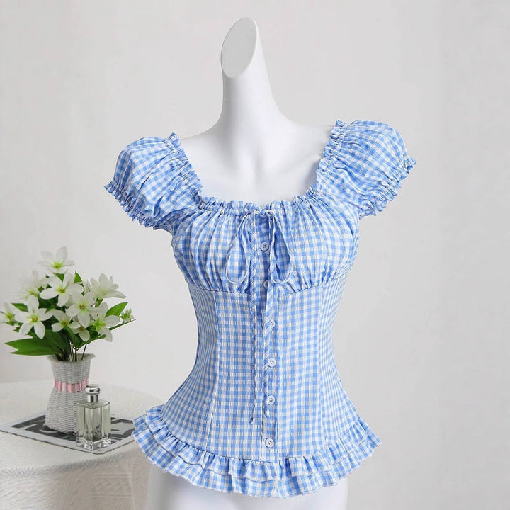 Dame ruffled topp i rutete design med knappdetaljer og elastisk fald Skjora