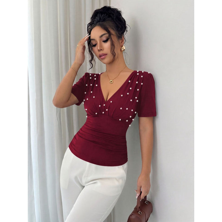 Dame elegant bluse med perle-detalj Skjora