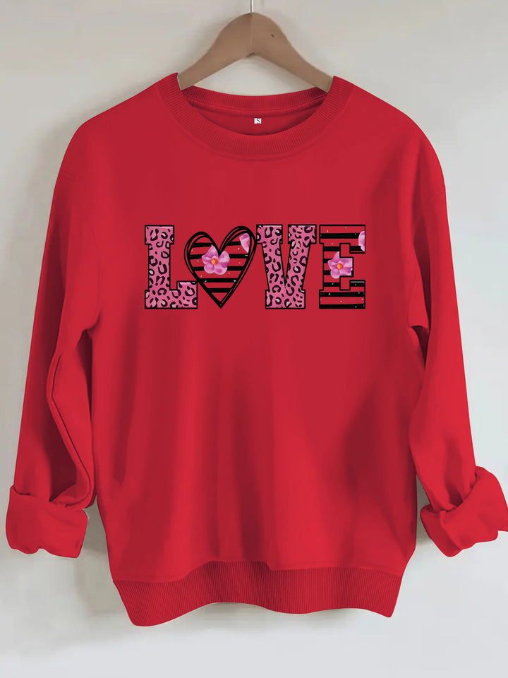 Dame sweatshirt med moderne leopard hjerte-design og behagelig passform Skjora