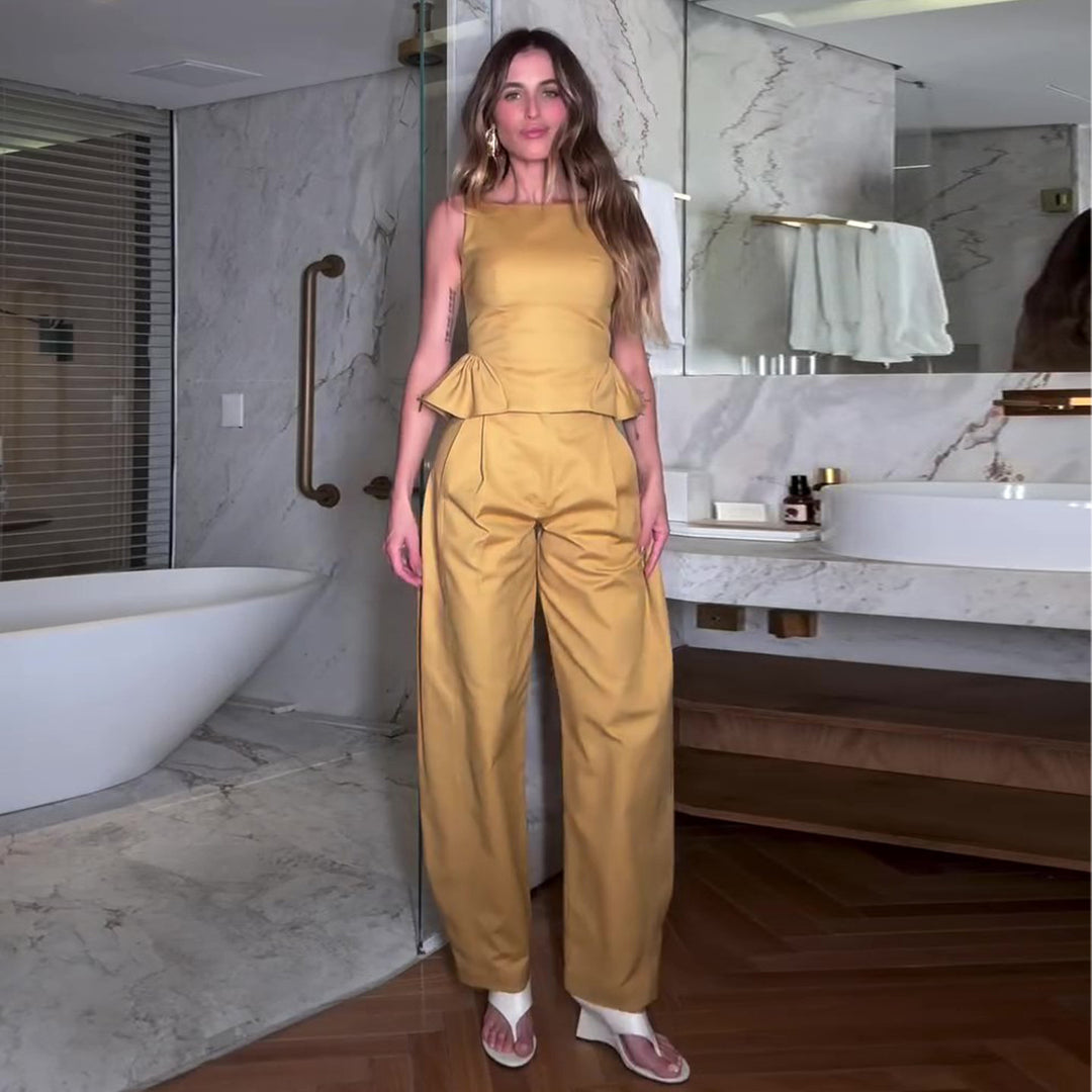 Kvinnes Elegant Jumpsuit med Peplum Detalj og Bred Ben