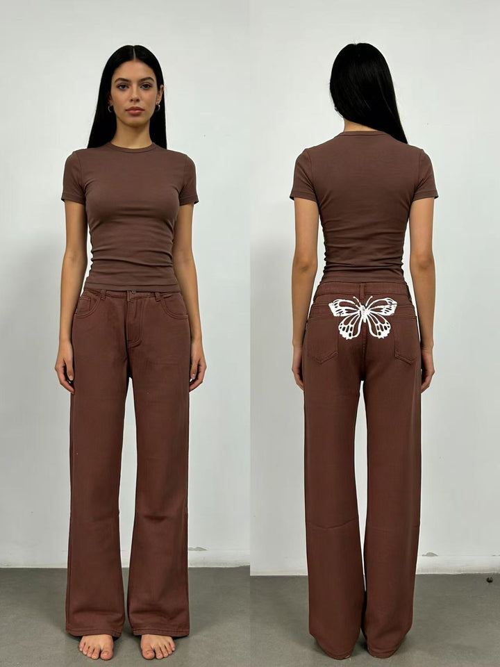 Dameviddejeans med kunstnerisk sommerfugl-design Skjora
