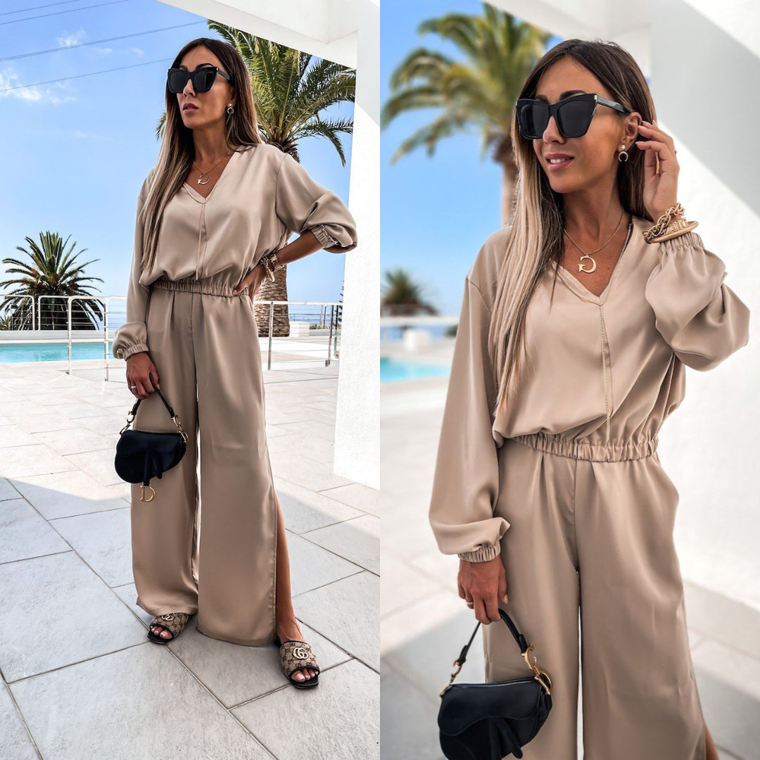 Kvinnelig elegant jumpsuit med vid-snitt bukser og V-hals Skjora