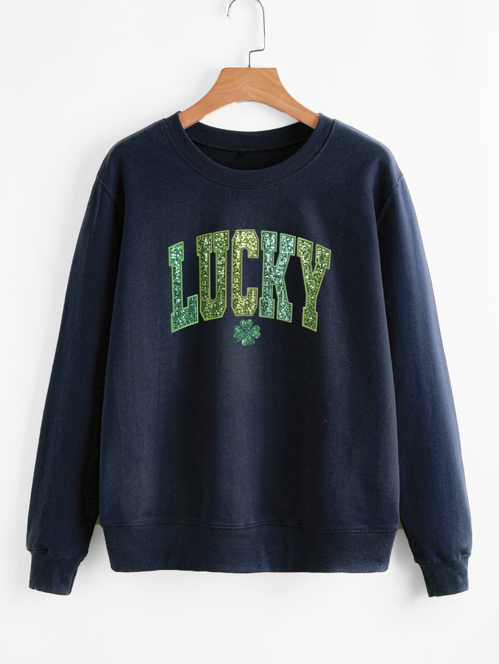 Dame uformell sweatshirt med glitrende skrift og firkløvermotiv Skjora