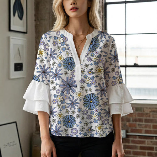Damebluse med voluminøse ermer og blomsterdesign Skjora