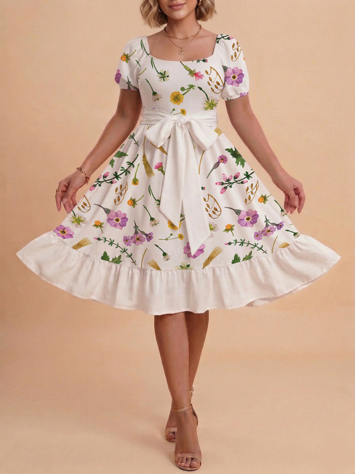 Damen modernes Blumenkleid mit elegantem Taillengürtel und asymmetrischem Saum Skjora
